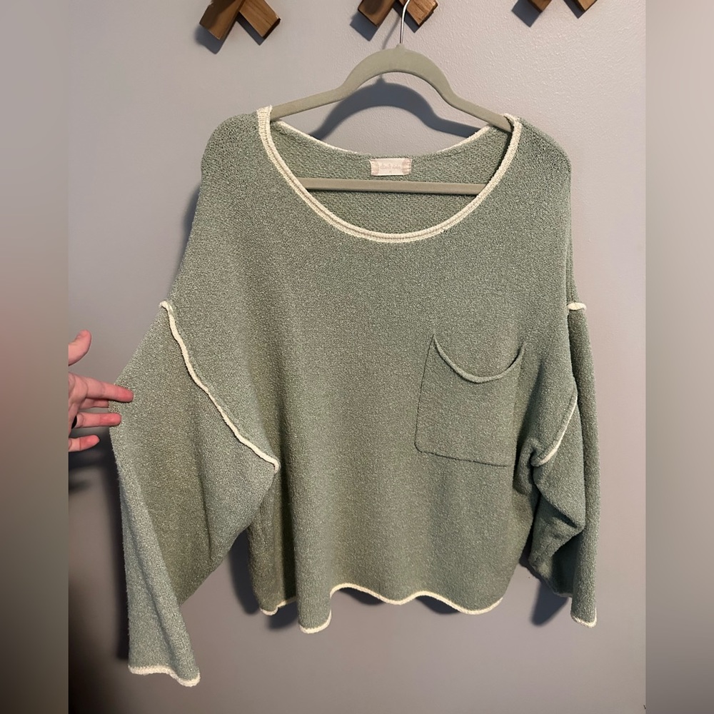 Medium, light green sweater